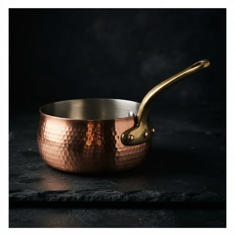 Hammered copper saucier, studio photograph