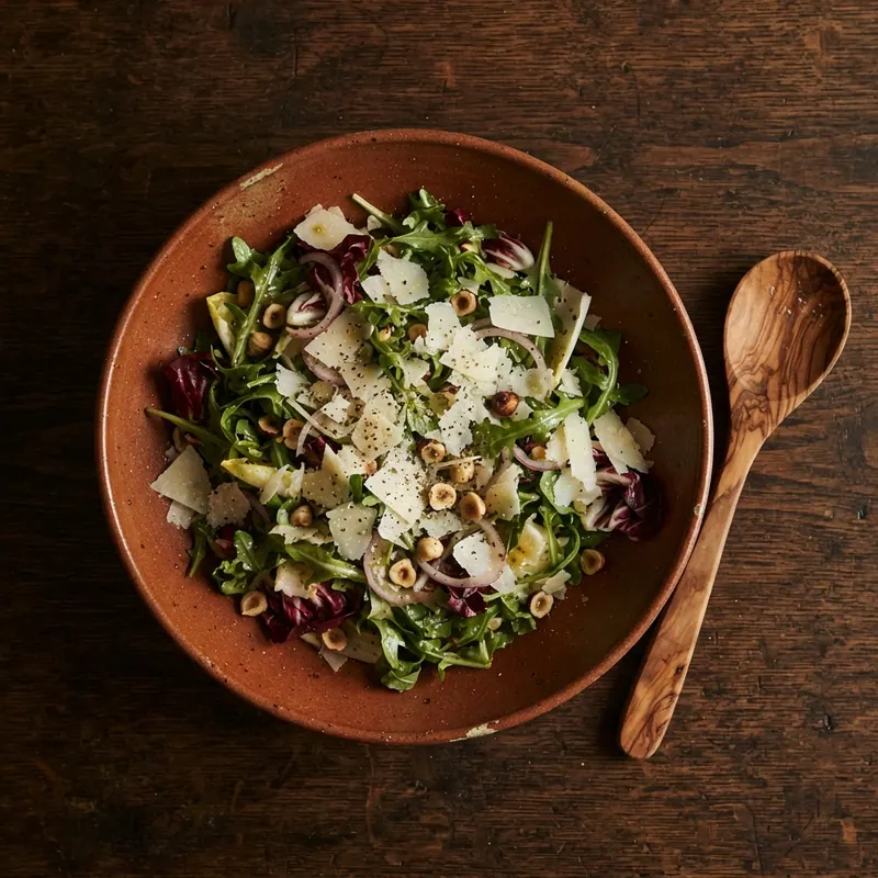 Stoneware bowl filled with greens on a dark table