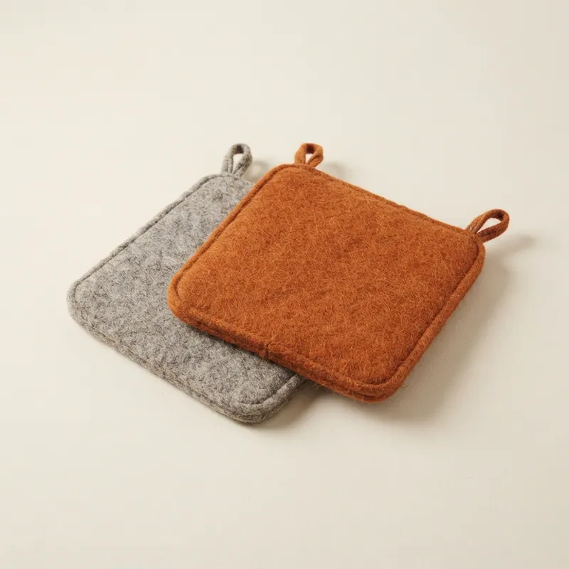 Felted seat pads in gray and ember