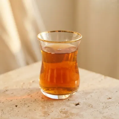 Detail of a gold-rimmed tea glass