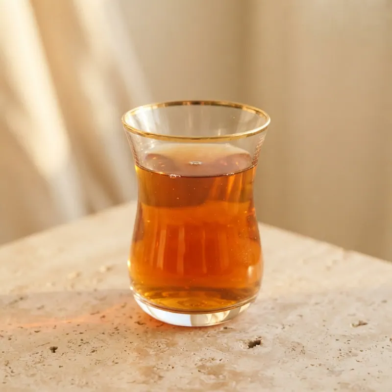 Four gilded tea glasses