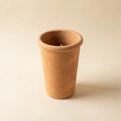 Tall narrow terracotta long tom pot