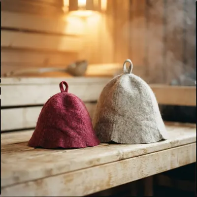 A small felt hat beside a large one